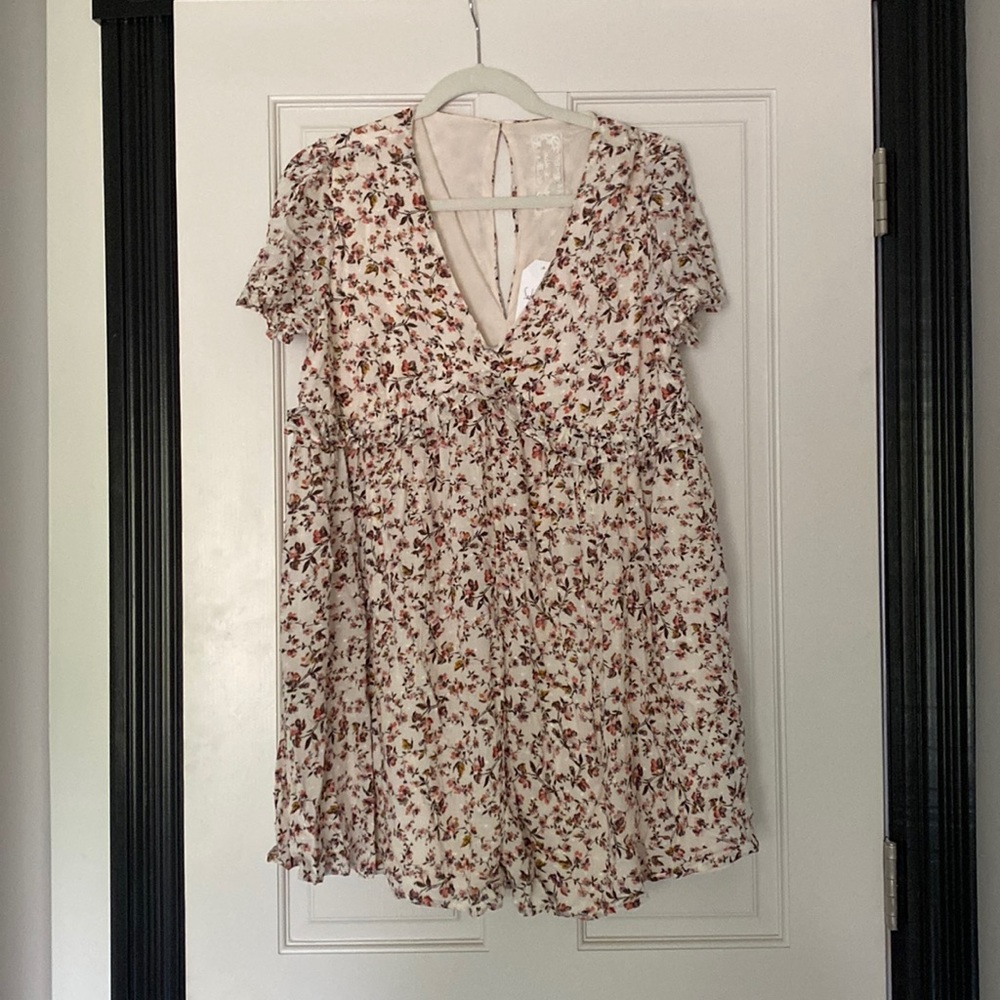 NWT! Cream romper with floral pattern